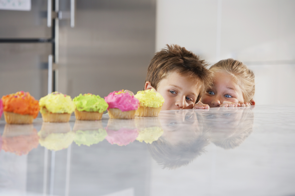 children-looking-at-cupcakes