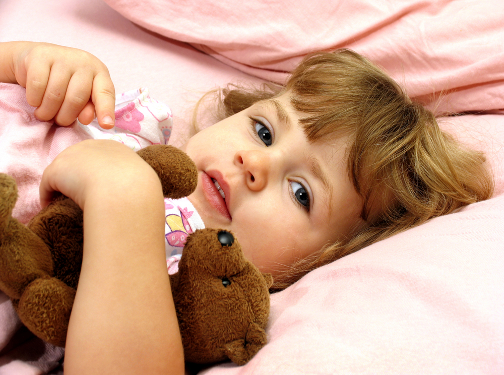 girl-in-bed-with-teddy-bear