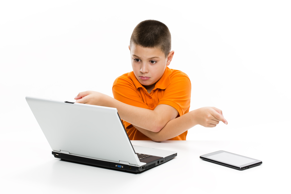 boy-with-computer-notebook-and-tablet
