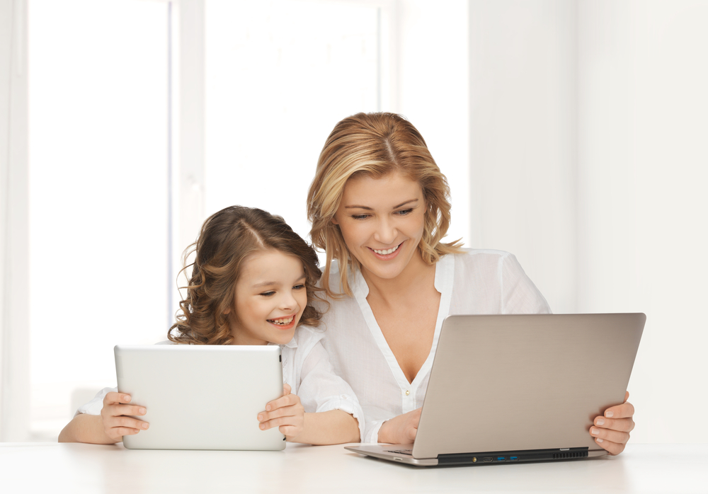 mom-and-daughter-using-laptops
