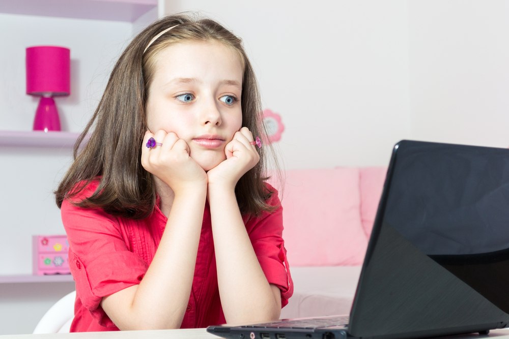 young-girl-surprised-in-front-of-laptop