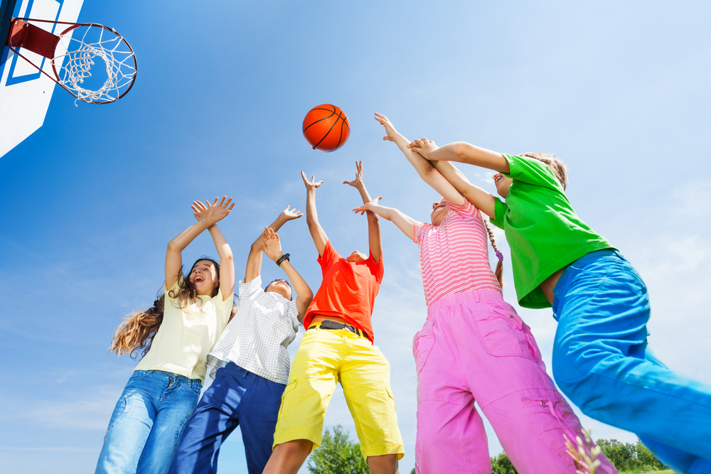 kids-playing-basketball-with-a-ball-up-in-sky
