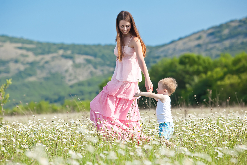 mother-walking-with-her-child-on-a-spring-day