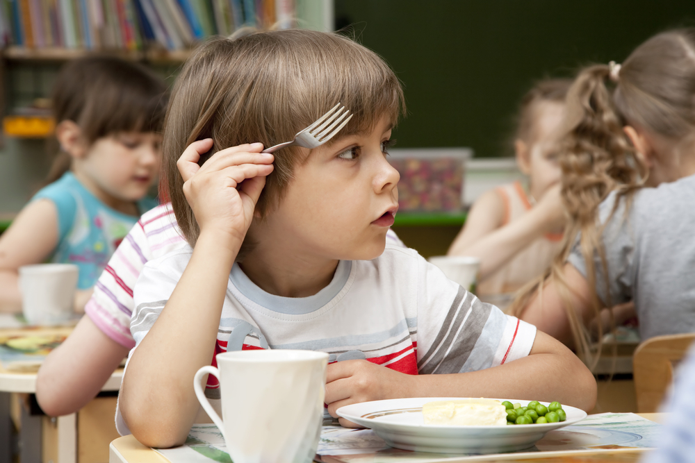 little-boy-has-a-lunch-in-the-kindergarten