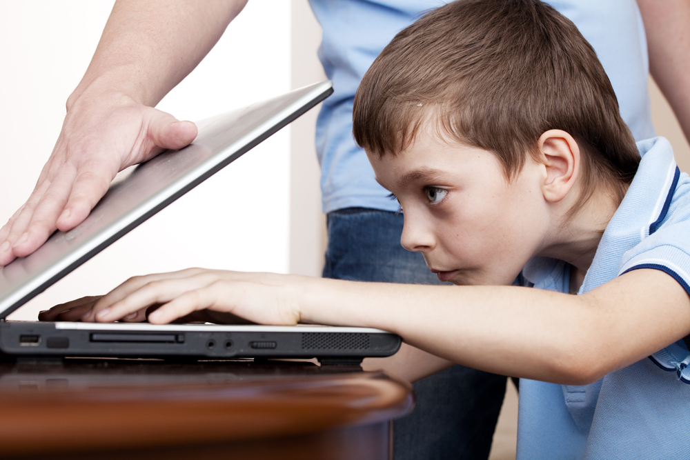 father-closes-the-son-s-laptop-computer-addiction-gambling