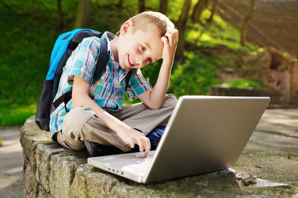 smiling-boy-with-laptop