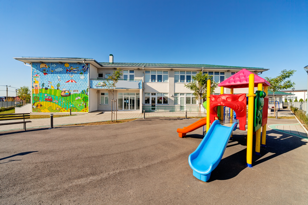 preschool-building-exterior-with-playground-on-a-sunny-day
