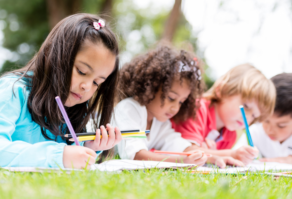 happy-group-of-children-coloring-at-the-park