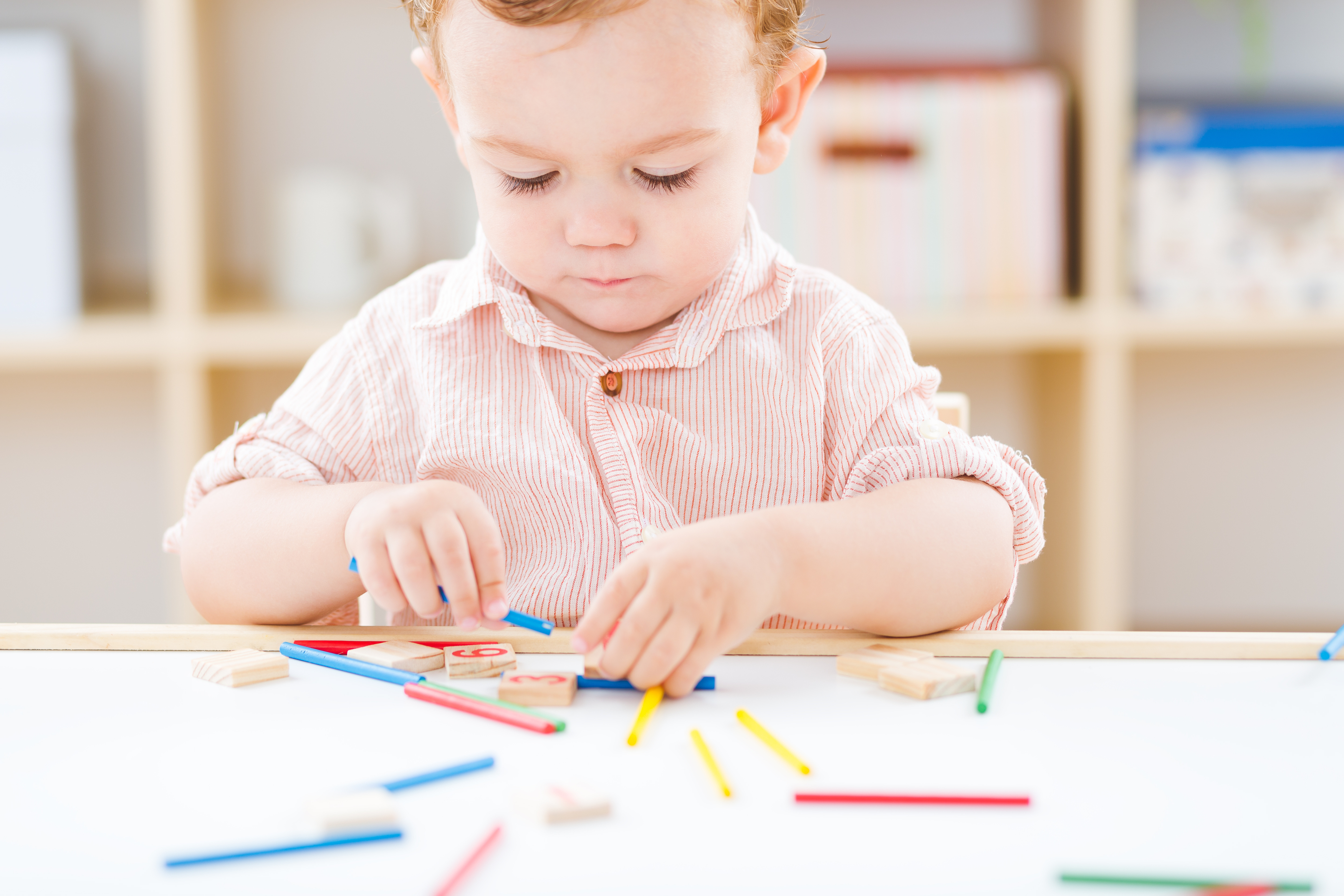 cute-little-boy-playing-numbers-sticks