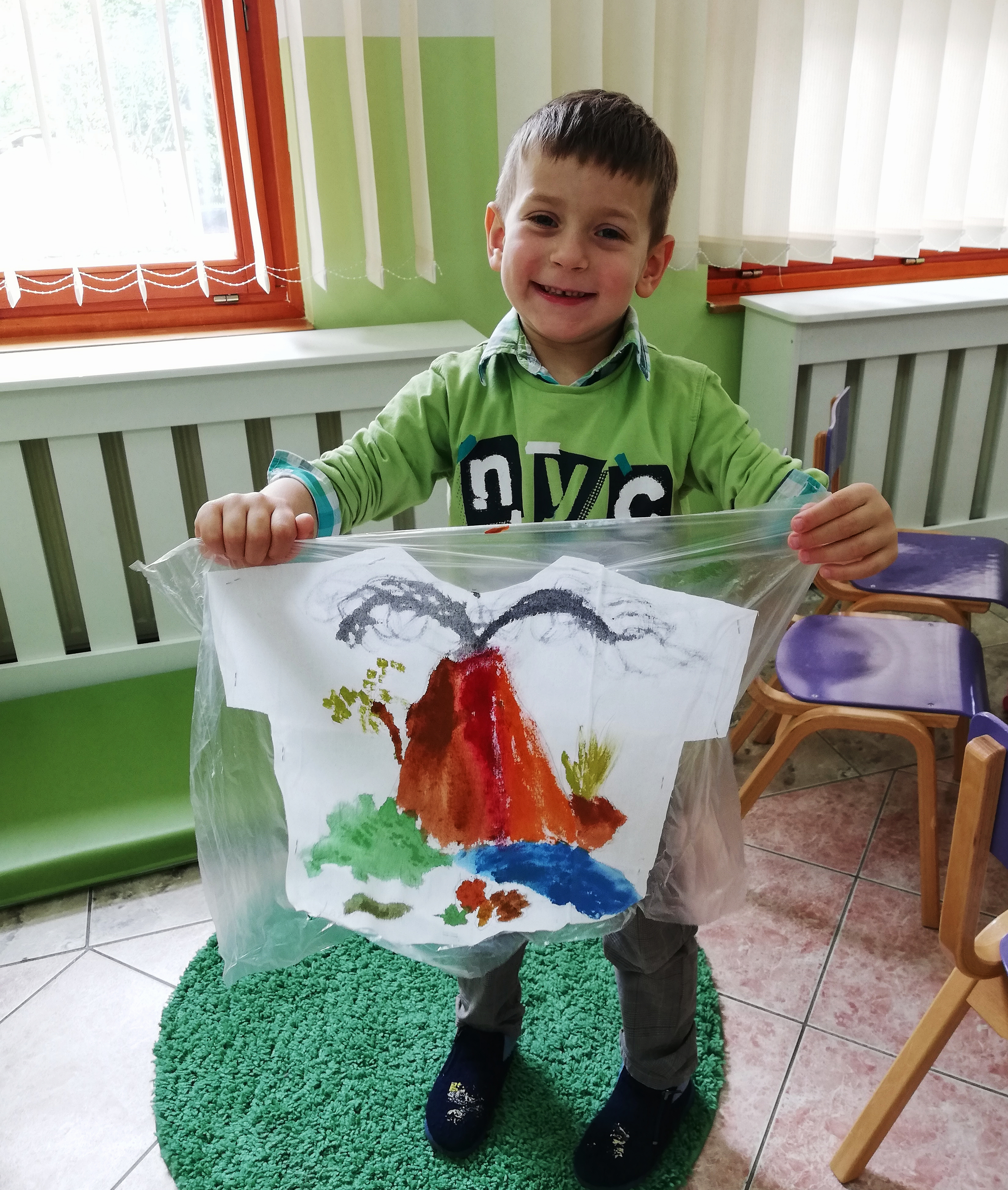 Lazar, who will soon turn 6, overcame all his communication difficulties. He proudly showed us his art project - a t-shirt with a volcano painted over it.